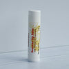 Beeswax lip balm on a light gray background