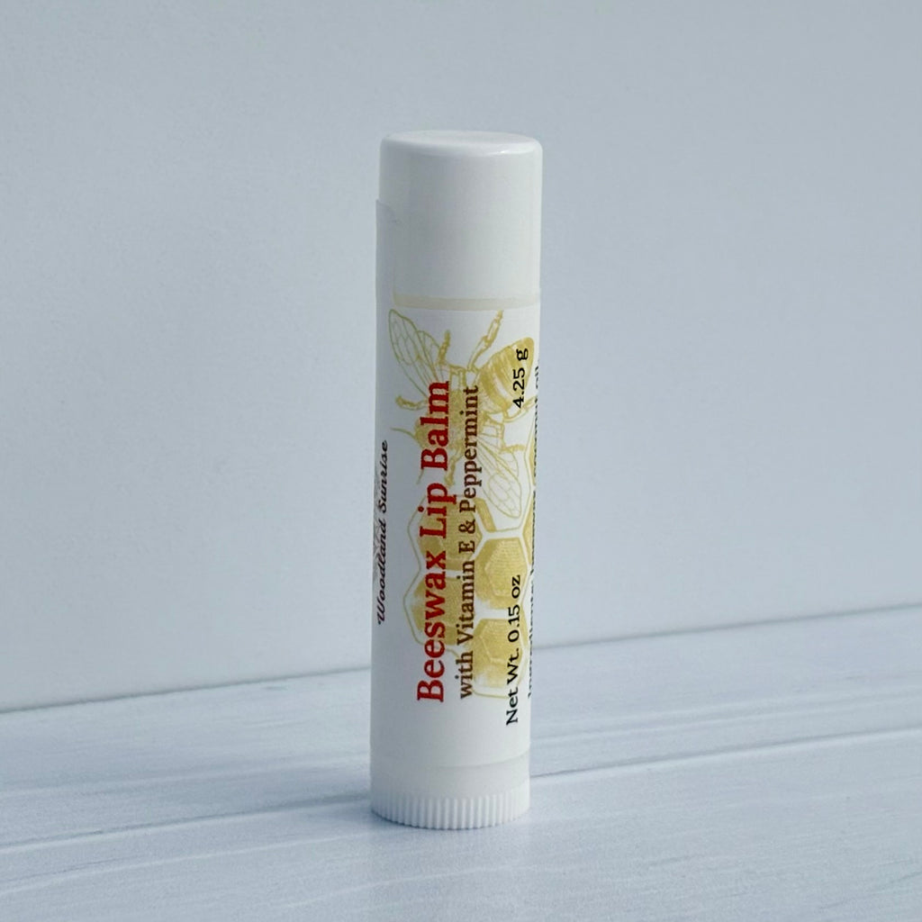 Beeswax lip balm on a light gray background