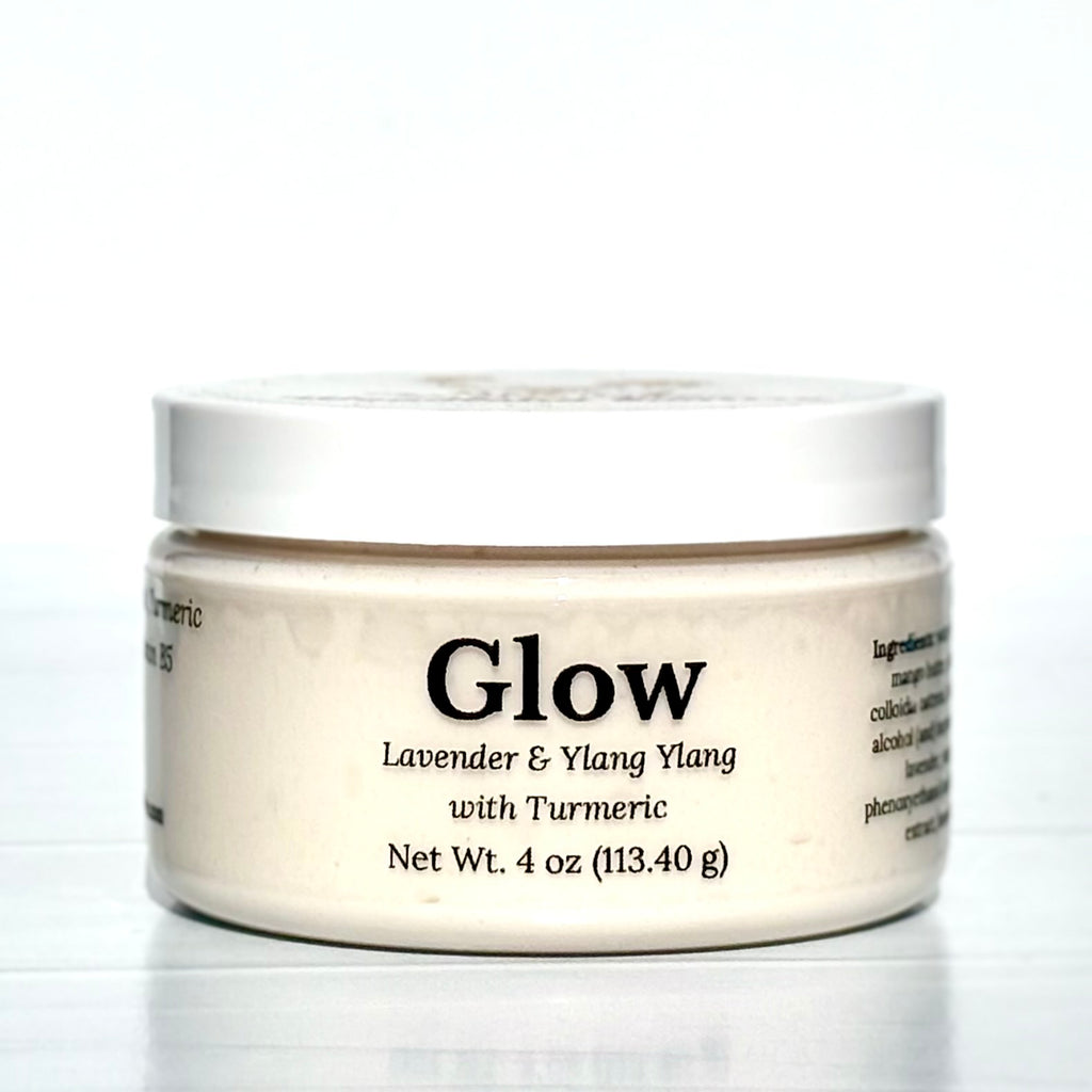 Jar of 'Glow' cream with lavender and ylang ylang on a white background