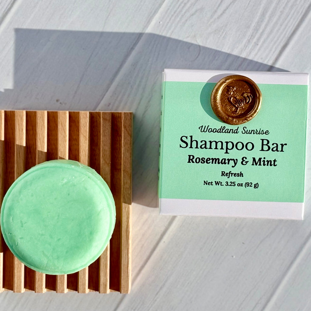 Shampoo bar with a wooden block and label on a light wooden surface