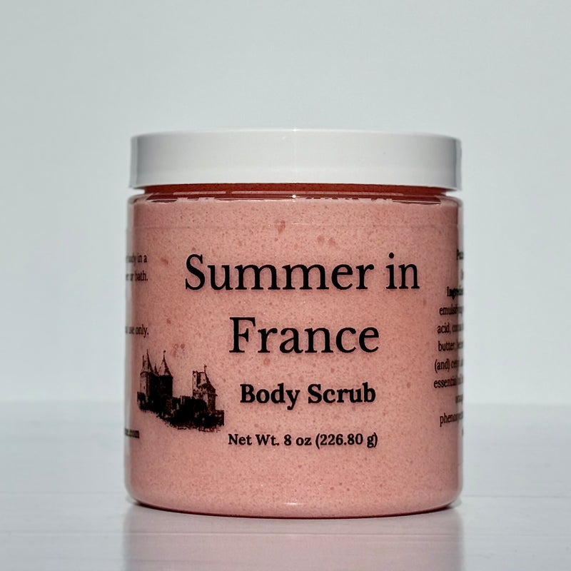 Jar of 'Summer in France' body scrub with a white lid on a light gray background