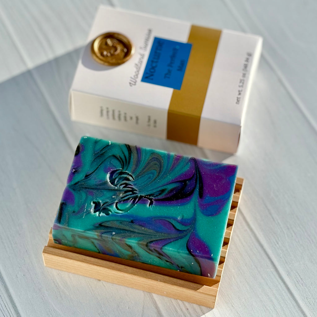 Colorful soap bar with a box on a white surface