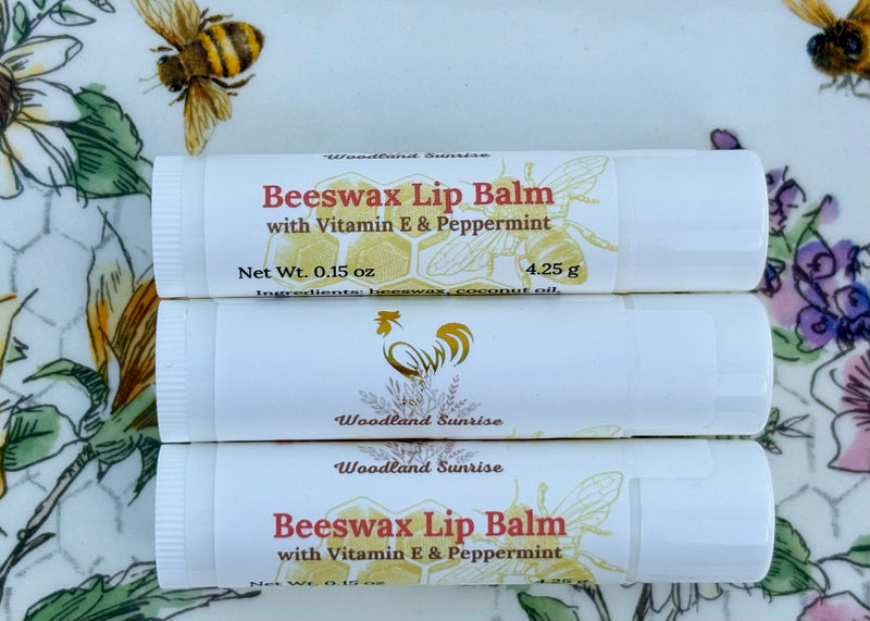 Woodland Sunrise Beeswax Lip Balm with Vitamin E and Peppermint Essential Oil displayed on a a floral background. 